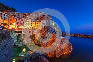 Manarola town on the coast of Ligurian Sea at dusk