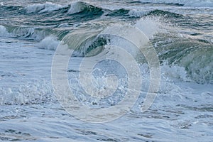 Waves on the ocean at sunrise photo