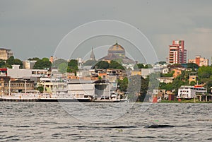 Manaus, Amazonas, Brazil: Manaus Opera House. Popular tourist trip on the ship. View from the boat to the port city of Manaus