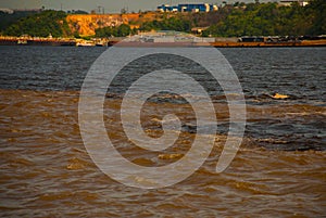 Manaus, Amazonas, Brazil: The merger of the two colored river, Rio Negro, Solimoes