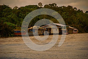 Manaus, Amazonas, Brazil: The merger of the two colored river, Rio Negro, Solimoes