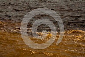 Manaus, Amazonas, Brazil: The merger of the two colored river, Rio Negro, Solimoes