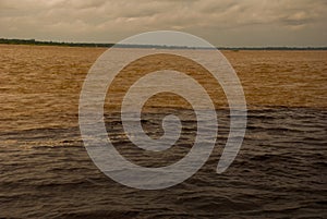 Manaus, Amazonas, Brazil: The merger of the two colored river, Rio Negro, Solimoes