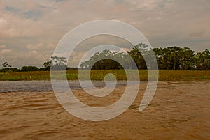 Manaus, Amazonas, Brazil: The merger of the two colored river, Rio Negro, Solimoes. Meeting, multi-colored waters do not mix, and