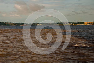 Manaus, Amazonas, Brazil: The merger of the two colored river, Rio Negro, Solimoes photo