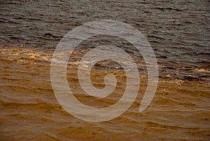 Manaus, Amazonas, Brazil: The merger of the two colored river, Rio Negro, Solimoes photo