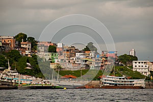 Manaus, Amazonas, Brazil: Popular tourist trip on the ship. View from the boat to the port city of Manaus