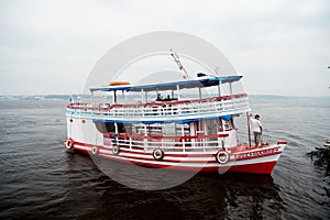 Manaus, Brazil - December 04, 2015: holiday cruiser ship on seascape. Pleasure boat float along sea coast. Summer vacation and tra