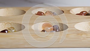 Mancala game playing on the table