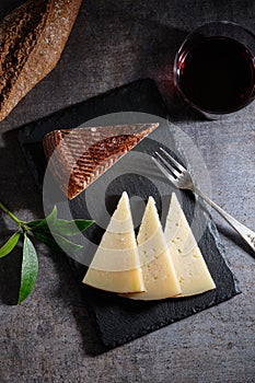 Manchego cheese cured with glass of wine