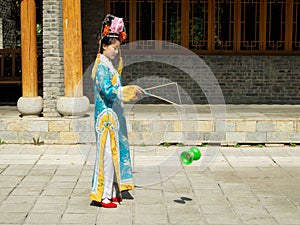 Manchurian girl juggling diabolo