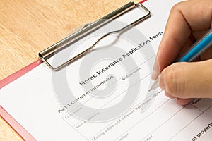 Mand fill the home insurance application form photo