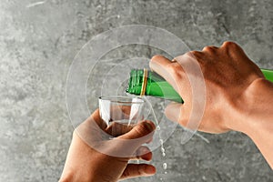 Mand Hand Pour Soju Korean Alcohol to the Sloki Glass photo