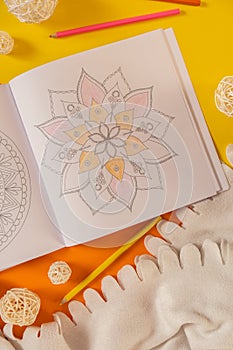 Mandalas antistress page to combat stress. Relaxing hobby mental wellbeing and art therapy. Meditative process of