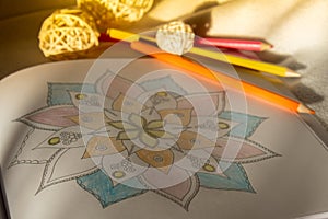 Mandalas antistress page to combat stress. Relaxing hobby mental wellbeing and art therapy. Meditative process of