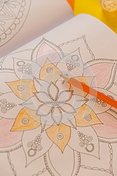 Mandalas antistress page to combat stress. Relaxing hobby mental wellbeing and art therapy. Meditative process of