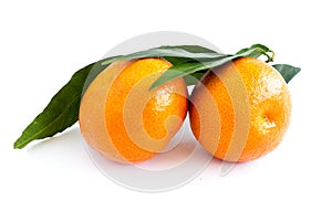 Mandarin or clementine with green leaf isolated on white background. Farm products. Healthy eating.