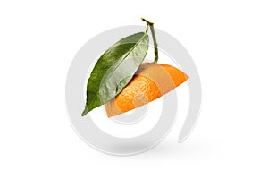 Mandarin cut in half with a green leaf. Fresh tangerine on a white isolated background. Open mouth concept. Tangerine