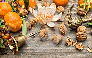 Mandarin fruits, walnuts and christmas tree branches