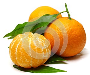 Mandarin, with green leaf, isolated on white background.