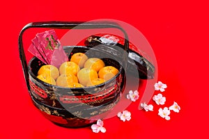 Mandarin oranges in basket with red envelope Good Luck character