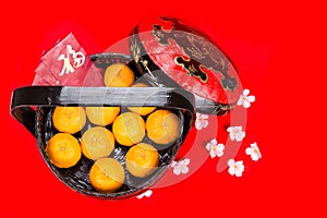 Mandarin oranges in basket with red envelope Good Luck character