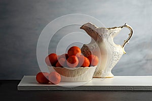 mandarin oranges in a white porcelain bowl
