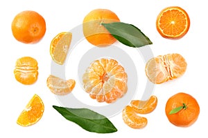 Mandarin with slices and green leaf isolated on white background. top view