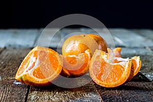 Mandarin, strawberry and chocolate on an old wooden table