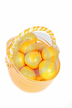 Mandarine in glass basket.