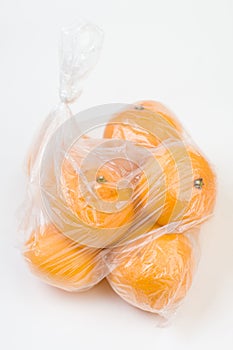 Mandarins in the polyethylene bag isolated