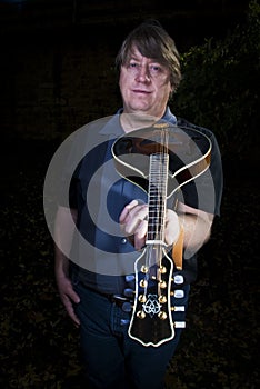 Mandolin Player showing off his instrument