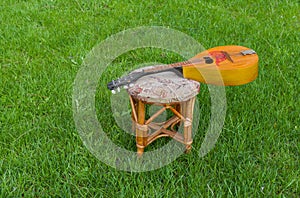 Mandoline having rest on a stool