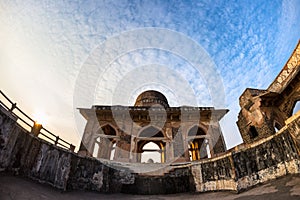 Mandu India, afghan ruins of islam kingdom, mosque monument and muslim tomb. View through door, Hindola Mahal.