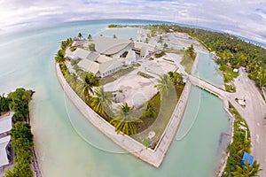 Maneaba ni Maungatabu Parliament of Kiribati building on motu in an atoll's lagoon, aerial view. House of Assembly, Tarawa. photo