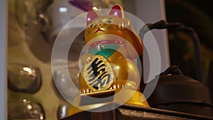 The maneki-neko, Beckoning cat in interior