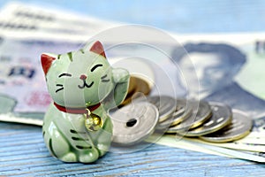 Maneki-neko, the lucky cat and Japanese money.