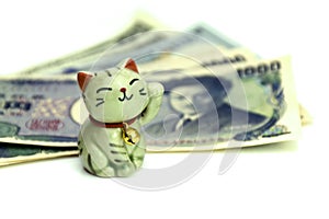 Maneki-neko, the lucky cat and Japanese money.