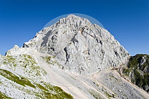 Mangart or Mangrt peak, a mountain in the Julian Alps, located on the border between Italy and Slovenia, at 2,679 metres high. photo