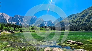 Mangart - Panoramic view of Superior Fusine alpine Lake (Laghi di Fusine) with majestic Mount Mangart