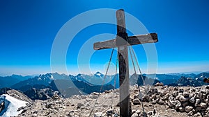 Mangart - Summit cross of majestic mountain peak Mangart (Mangrt) in Julian Alps, Friuli Venezia Giulia