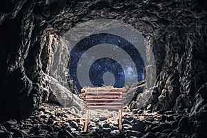 Manger in a cave under a bright starry sky during the birth of Jesus Christ