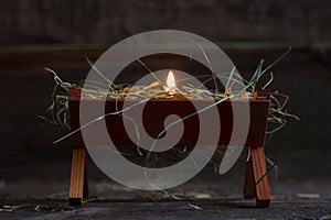 Manger Jesus and light of hope abstract christmas symbol