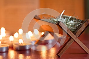 Manger nativity scene candles and bible in night abstract background