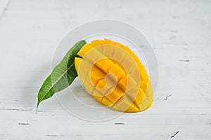 Mango in the basket on White wood background