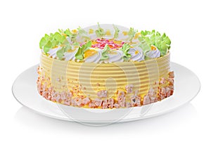 Mango cake isolated on white plate