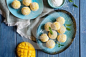 Mango Coconut Ladoo â€“ sweet balls made of mango puree, desiccated coconut and condensed milk