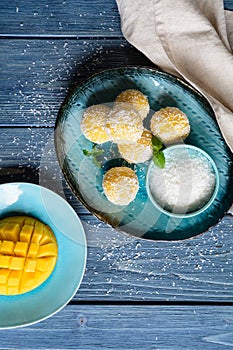 Mango Coconut Ladoo â€“ sweet balls made of mango puree, desiccated coconut and condensed milk