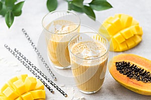 Mango Coconut Papaya Tropical Fruit Smoothie In Drinking Glass
