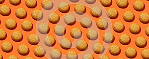 Mango Cookies with coconut in pattern on the orange background. No sugar. Top view  .Healthy and tasty Cookies with protein.